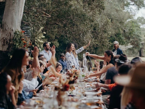 People cheering at a table.