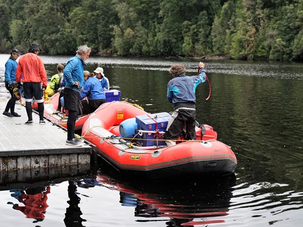 Rafters pulling into the jetty at Sir John Falls on the Gordon River