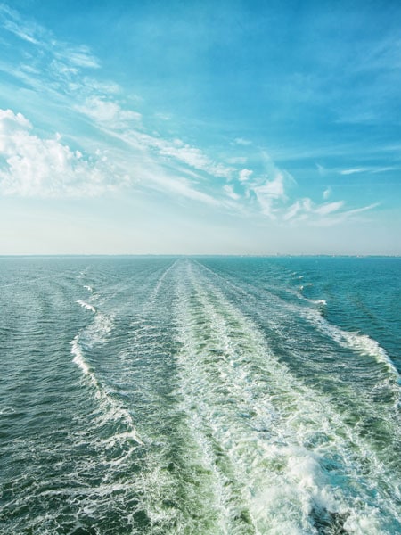 Rearview of cruise and its wake in the water