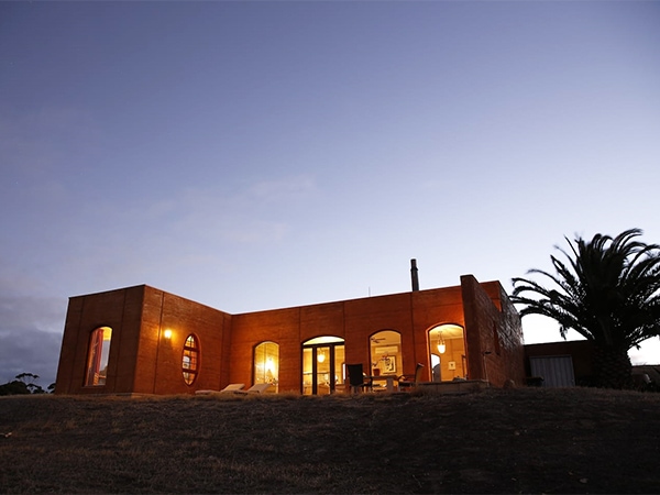 The Sky House facade at night