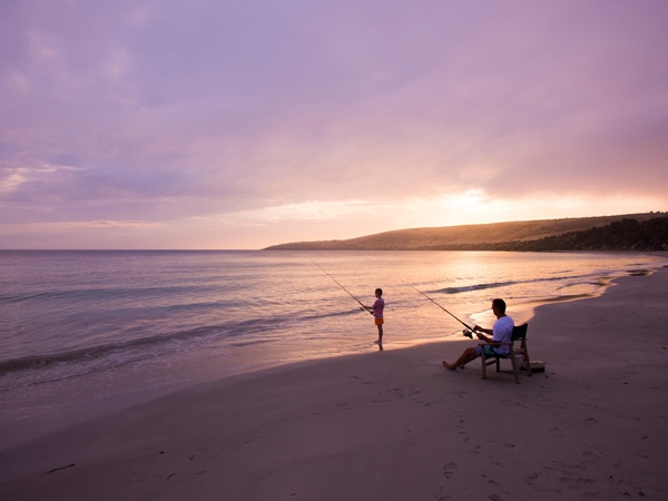 Man and boy fishing at Antechamber Bay on Kangaroo Island.