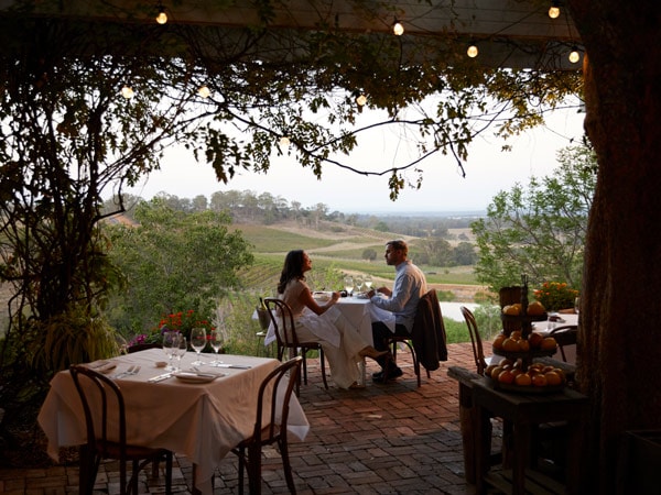 a couple having a romantic dinner at Bistro Molines, Hunter Valley