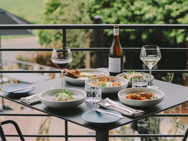 dining on the balcony at Esca Bimbadgen