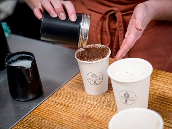 a barista preparing coffee at Icky Sticky
