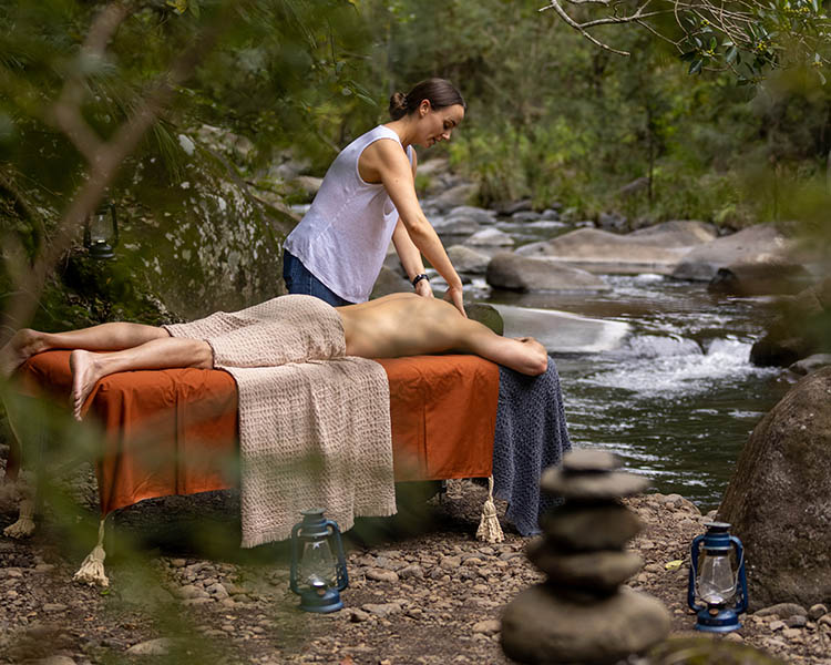 Man getting a massage in the middle of nature