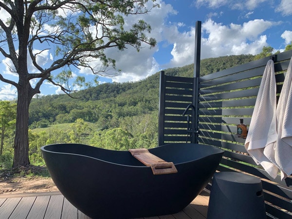 an outdoor bathtub at Rosebook Eco Tiny Home