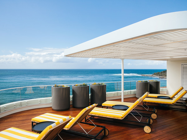 sun loungers facing the sea at The Surf Yamba
