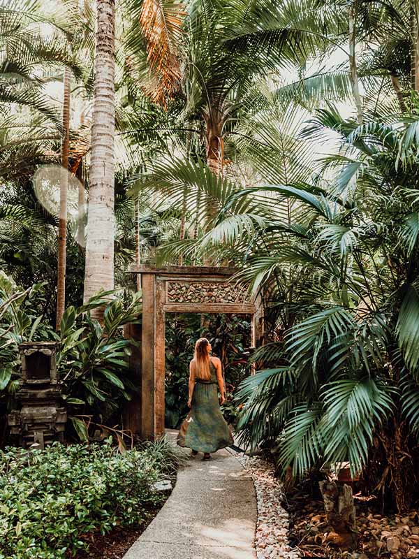 Woman Walking under Balinese-Style Ikatan Spa, Noosa