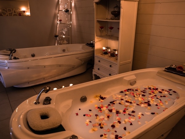 a bathtub with petals at NuYou Natural Beauty Day Spa