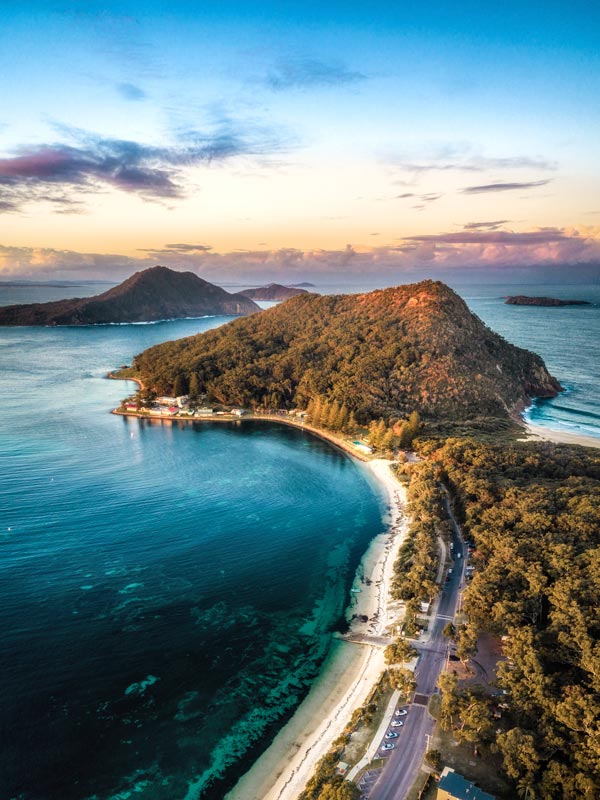 Aerial overlooking Shoal Bay, Tomaree Head and Mount Yacaaba