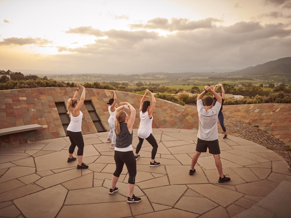 a group doing an exercise program at Elysia Wellness Retreat