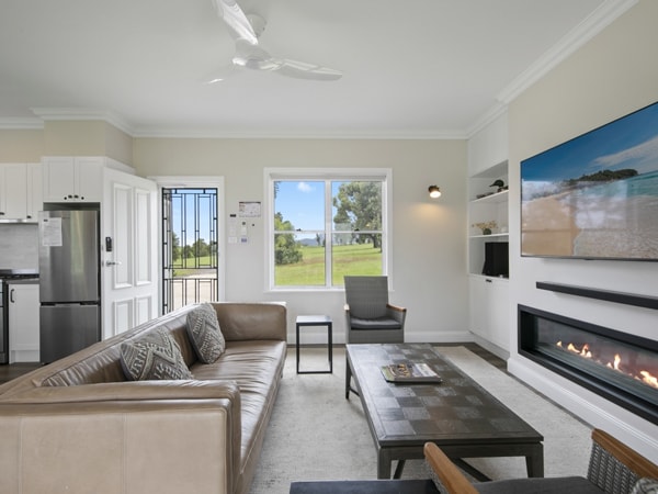 the living room with windows at Greystone Estate