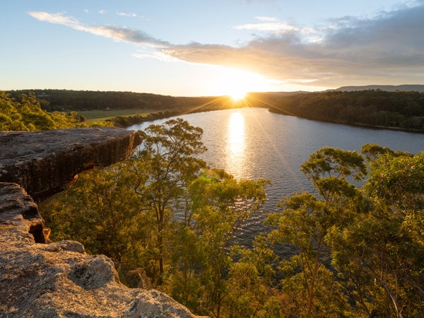 Sun setting over Hanging Rock Lookout and the Shoalhaven River, Nowra. (Image: Destination NSW)