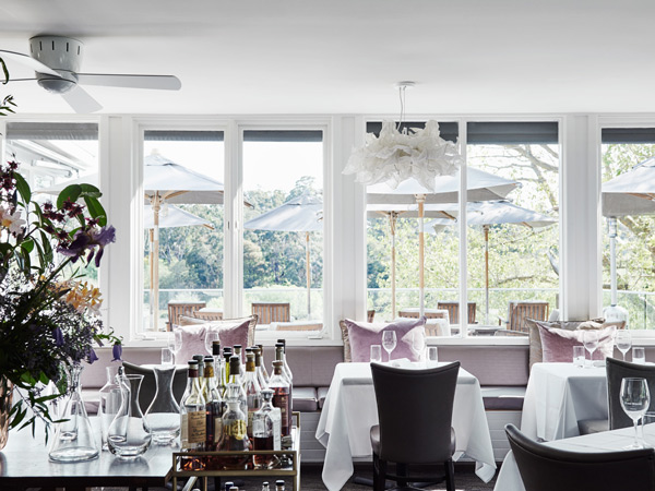 the white-washed dining interior of Lake House Restaurant, Daylesford