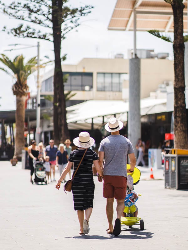 Couple strolling, Paradise Centre, Gold Coast, QLD, Australia