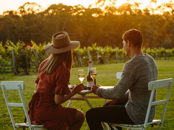 a couple dining by the vines at Spicers Vineyard Estate