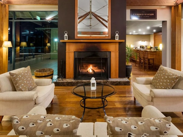 a living room with a fireplace at Oaks Cypress Lakes Resort