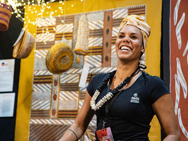 Cassandra Trevilyan Hayes of Mimi Aboriginal Art Craft at 2019 Darwin Aboriginal Art Fair, photo by Dylan Buckee
