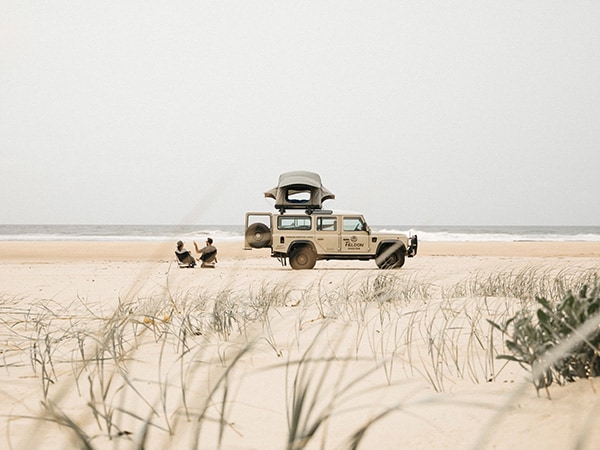 Couple beach camping at Crescent Head on the North Coast, Macleay Valley Coast, NSW, Australia