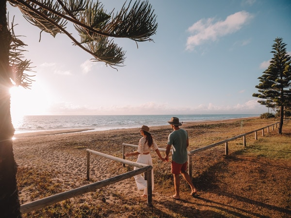 a couple strolling at Forrest Beach