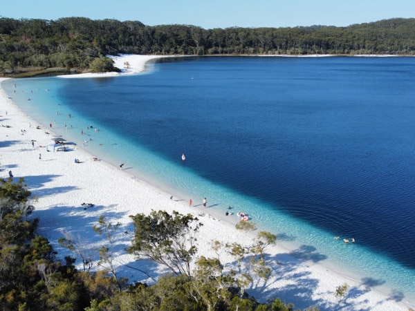 Aerial view of Lake McKenzie located on K'gari (Fraser Island) (Image: Tourism and Events Queensland and Geoff Aquino)