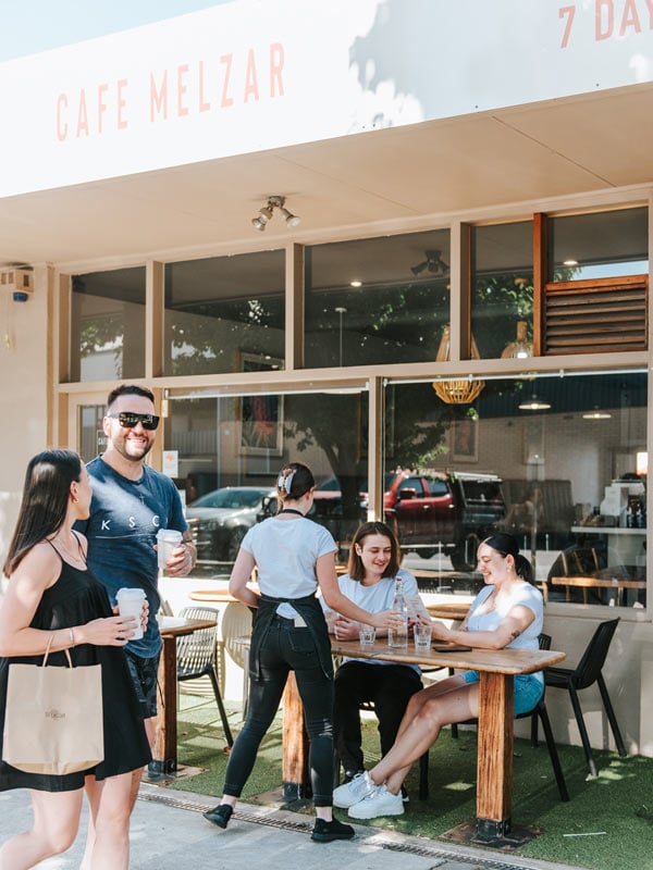 A group of people are served at Cafe Melzar. (Image: Cafe Melzar)