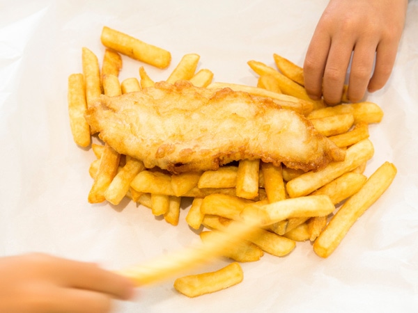 Traditional fish and chips wrapped in paper. (Image: The Fresh Fish Place)