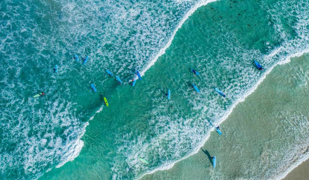 Aerial shot of surfers at Redgate Beach in Margaret River. (Image: Tourism Western Australia)
