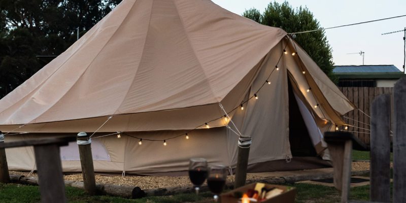 a glamping tent with bonfire at Pine Country Caravan Park in Mount Gambier