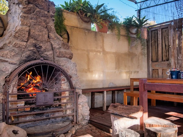 the beer garden with a fireplace at The Prince of Wales Hotel