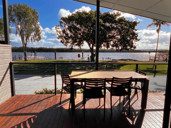 an outdoor deck facing Clarence River at Fishing Haven Holiday Park, Yamba