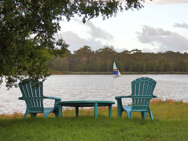 two chairs by the lake at Secret Lake Retreat, Yamba