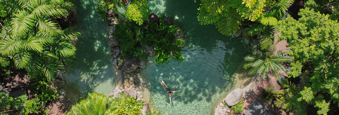 Aerial view of woman swimming in pool