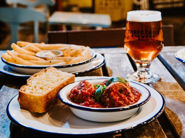 pub meals with a drink on the table at Three Tails Brewery, Mudgee