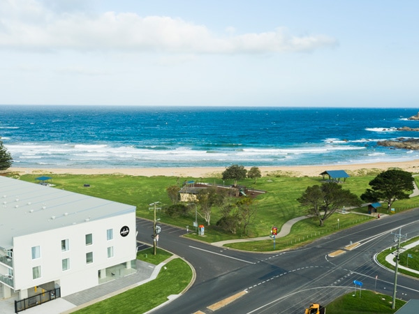 an aerial view of Abode Malua Bay near the beach