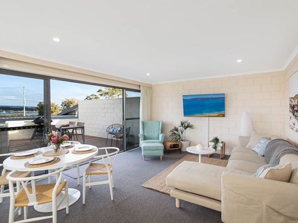 the living and dining room at All Decked Out at Penguin Mews, Merimbula