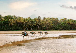 riding horses along Myall Beach, Cape Tribulation