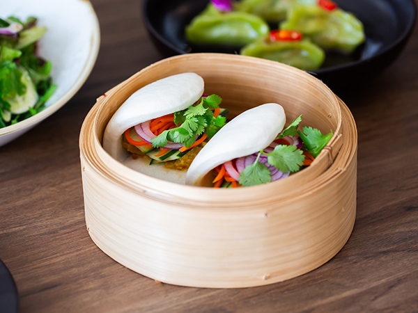 A steamer full of vegan Bao buns