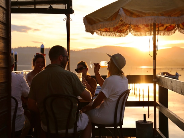 drinking at sunset by the edge of the pier at Sunny’s Kiosk, Merimbula