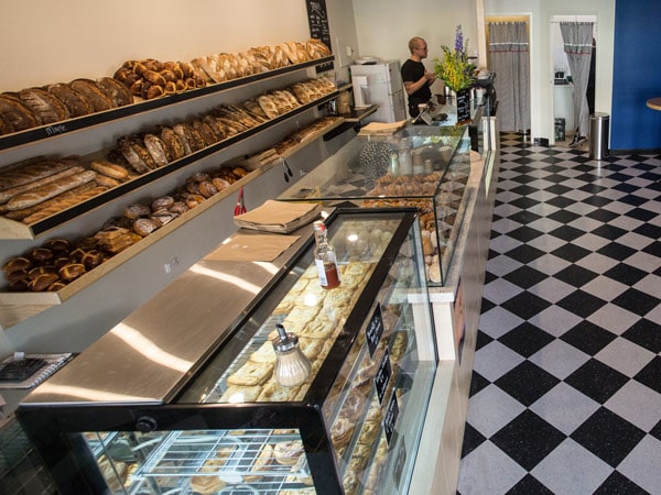 Serving customers at The Bakery in Alice Springs. (Image: Tourism NT and Neil Rilatt)