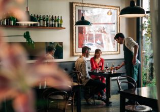 A couple being served at Fico restaurant in Hobart, Tasmania, Australia
