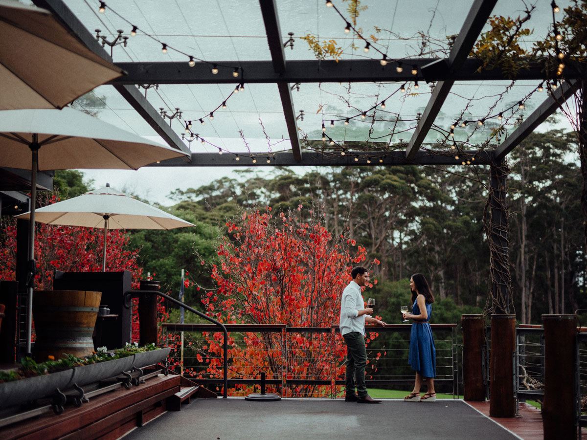 a couple enjoying wine on the outdoor deck of Leeuwin Estate, Margaret River