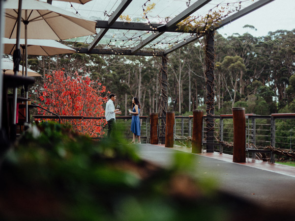 a couple enjoying wine on the alfresco deck at Leeuwin Estate, Margaret River