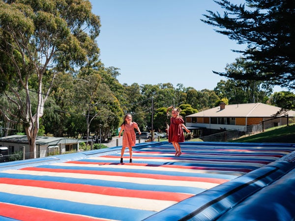 kids enjoying at the giant jumping pad, Park Lane Holiday Park, Yarra Valley