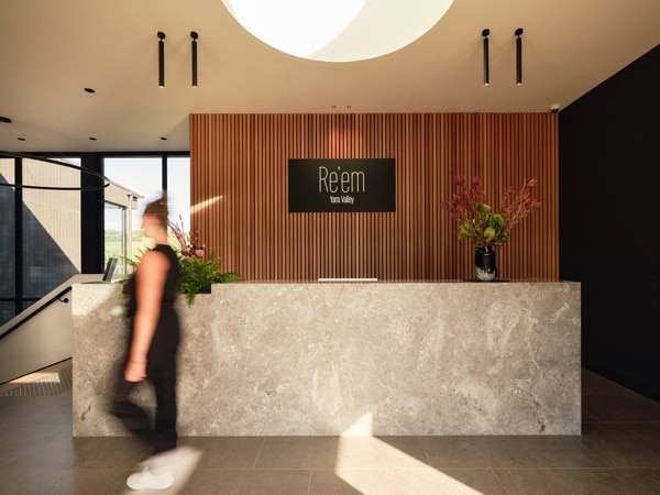 a woman standing at the reception of Re’em, Yarra Valley