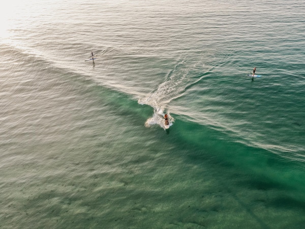 People surfing at Birubi Beach.