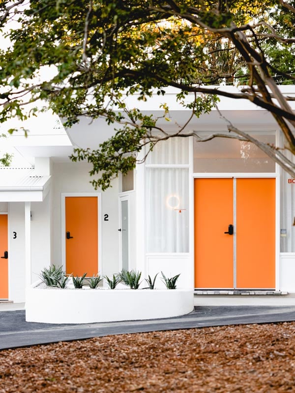 The orange and white Berry View Motel