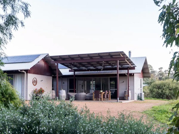 A house outdoors surrounded by nature.
