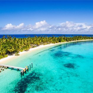 Crystal clear waters of the Cocos (Keeling) Islands with jetty