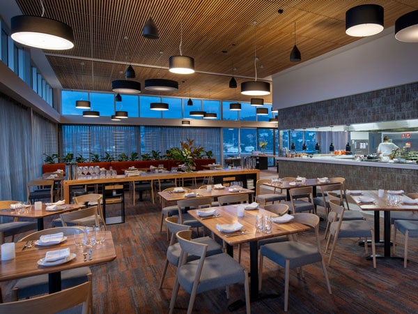 Interior shot with waterfront view in the background of Grain of the Silos in Launceston